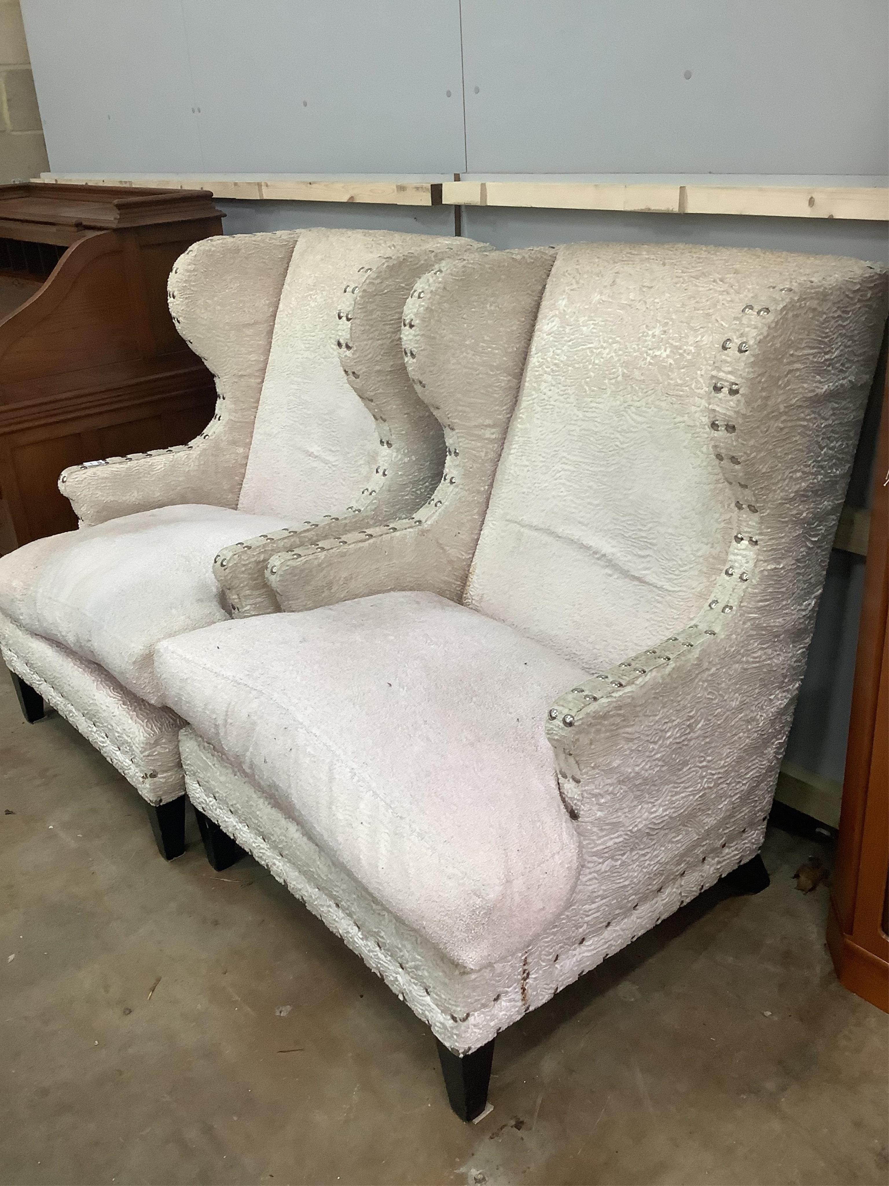 A pair of Martin Fleming armchairs with zebra cushions, width 85cm, depth 80cm, height 112cm. Condition - fair